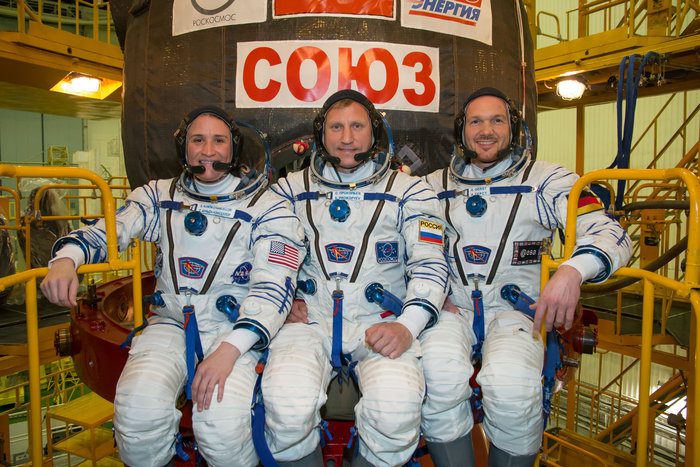 In the Integration Facility at the Baikonur Cosmodrome in Kazakhstan, Expedition 56 crewmembers Serena Aunon-Chancellor of NASA (left), Sergey Prokopyev of Roscosmos (center) and Alexander Gerst of the European Space Agency (right) pose for pictures in their Russian Sokol launch and entry suits in front of the Soyuz MS-09 spacecraft May 20 as part of their first fit check dress rehearsal activities. They will launch June 6 on the Soyuz MS-09 spacecraft from Baikonur for a six-month mission on the International Space Station.
NASA/Victor Zelentsov