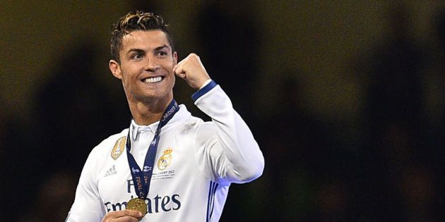 Real Madrid's Cristiano Ronaldo celebrates after Real Madrid won the UEFA Champions League final football match between Juventus and Real Madrid at The Principality Stadium in Cardiff, south Wales, on June 3, 2017. / AFP PHOTO / Glyn KIRK