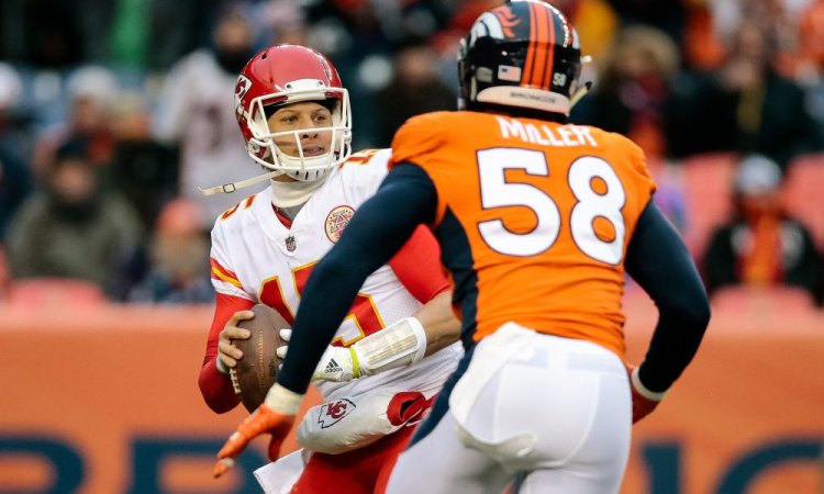 Dec 31, 2017; Denver, CO, USA; Kansas City Chiefs quarterback Patrick Mahomes (15) looks to pass under pressure from Denver Broncos linebacker Von Miller (58) in the third quarter at Sports Authority Field at Mile High. Mandatory Credit: Isaiah J. Downing-USA TODAY Sports