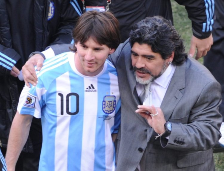Argentina's coach Diego Maradona (R) and Argentina's striker Lionel Messi speak after their Group B first round 2010 World Cup football match Argentina versus South Korea on June 17, 2010 at Soccer City stadium in Soweto, suburban Johannesburg. Argentina won the match 4-1. NO PUSH TO MOBILE / MOBILE USE SOLELY WITHIN EDITORIAL ARTICLE - AFP PHOTO / GABRIEL BOUYS (Photo credit should read GABRIEL BOUYS/AFP via Getty Images)