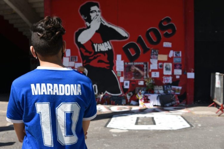ROSARIO, ARGENTINA - NOVEMBER 26: Fans pay tribute to late Diego Maradona in an altar outside Estadio Marcelo Bielsa  in Rosario, Argentina. Diego Maradona played for Newell's Old Boys between October 1993 and January 1994, returning to Argentina from playing in European clubs after nine years. Despite his short stay in Rosario, fans consider him an icon of the team and a tribune was named after him. (Photo by Luciano Bisbal/Getty Images)