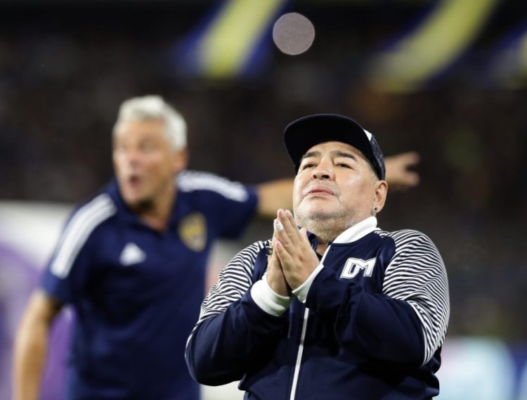 Argentine former football star Diego Maradona acknowledges spectators during an homage before the start of the Argentina First Division 2020 Superliga Tournament football match Boca Juniors vs Gimnasia La Plata, at La Bombonera stadium, in Buenos Aires, on March 7, 2020. (Photo by ALEJANDRO PAGNI / AFP) (Photo by ALEJANDRO PAGNI/AFP via Getty Images)