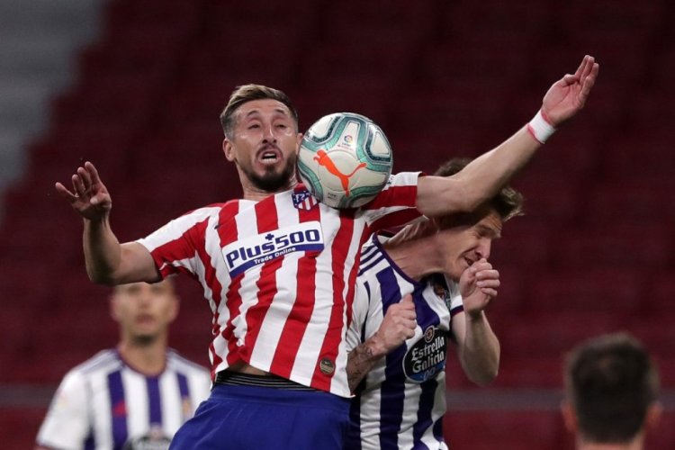 MADRID, SPAIN - JUNE 20: Hector Herrera of Atletico Madrid battles for possession in the air with Raul Garcia of Real Valladolid from during the La Liga match between Club Atletico de Madrid and Real Valladolid CF at Wanda Metropolitano on June 20, 2020 in Madrid, Spain. (Photo by Gonzalo Arroyo Moreno/Getty Images)