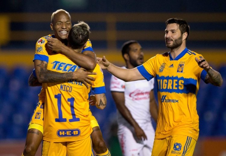 Tigres' Luis Quinones (L) celebrates after scoring against Tijuana during a Mexican Clausura tournament football match at the Universitario stadium in Monterrey, Mexico, on February 21, 2021. (Photo by Julio Cesar AGUILAR / AFP) (Photo by JULIO CESAR AGUILAR/AFP via Getty Images)