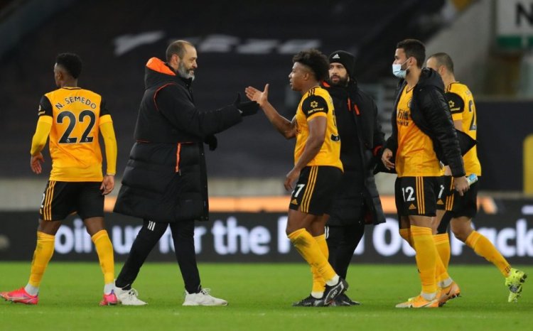 WOLVERHAMPTON, ENGLAND - FEBRUARY 19: Nuno Espirito Santo, Manager of Wolverhampton Wanderers embraces Adama Traore of Wolverhampton Wanderers at full-time after the Premier League match between Wolverhampton Wanderers and Leeds United at Molineux on February 19, 2021 in Wolverhampton, England. Sporting stadiums around the UK remain under strict restrictions due to the Coronavirus Pandemic as Government social distancing laws prohibit fans inside venues resulting in games being played behind closed doors. (Photo by Catherine Ivill/Getty Images)