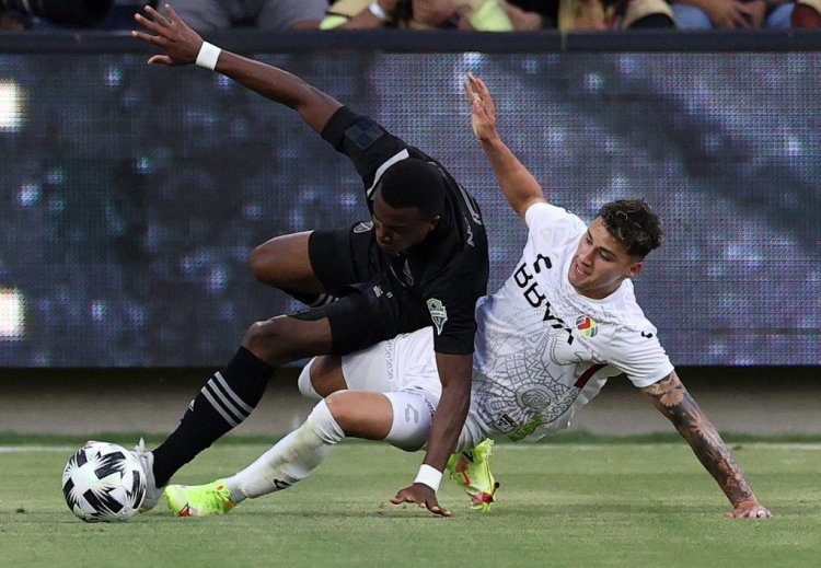 LOS ANGELES, CALIFORNIA - AUGUST 25:  Nouhou #5 of the MLS All-Stars falls on top of Jorge Sánchez #3 of the Liga MX All-Stars in the first half during the 2021 MLS All-Star game at Banc of California Stadium on August 25, 2021 in Los Angeles, California. (Photo by Ronald Martinez/Getty Images)