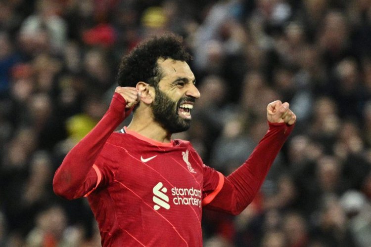 Liverpool's Egyptian midfielder Mohamed Salah celebrates after scoring his team fourth goal during the English Premier League football match between Liverpool and Manchester United at Anfield in Liverpool, north west England on April 19, 2022. - - RESTRICTED TO EDITORIAL USE. No use with unauthorized audio, video, data, fixture lists, club/league logos or 'live' services. Online in-match use limited to 120 images. An additional 40 images may be used in extra time. No video emulation. Social media in-match use limited to 120 images. An additional 40 images may be used in extra time. No use in betting publications, games or single club/league/player publications. (Photo by Oli SCARFF / AFP) / RESTRICTED TO EDITORIAL USE. No use with unauthorized audio, video, data, fixture lists, club/league logos or 'live' services. Online in-match use limited to 120 images. An additional 40 images may be used in extra time. No video emulation. Social media in-match use limited to 120 images. An additional 40 images may be used in extra time. No use in betting publications, games or single club/league/player publications. / RESTRICTED TO EDITORIAL USE. No use with unauthorized audio, video, data, fixture lists, club/league logos or 'live' services. Online in-match use limited to 120 images. An additional 40 images may be used in extra time. No video emulation. Social media in-match use limited to 120 images. An additional 40 images may be used in extra time. No use in betting publications, games or single club/league/player publications. (Photo by OLI SCARFF/AFP via Getty Images)