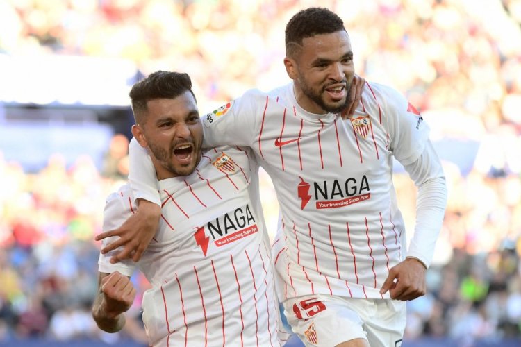 Sevilla's Mexican forward Jesus Manuel Corona aka Tecatito (L) celebrates with Sevilla's Moroccan forward Youssef En-Nesyri after scoring his team's second goal during the Spanish League football match between Levante UD and Sevilla FC at the Ciutat de Valencia stadium in Valencia on April 21, 2022. (Photo by Jose Jordan / AFP) (Photo by JOSE JORDAN/AFP via Getty Images)