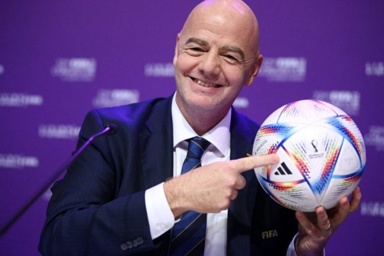 FIFA president Gianni Infantino poses with Al Rihla, the official match ball before a press conference during the 72nd FIFA Congress in the Qatari capital Doha, on March 31, 2022. - The countdown towards the most controversial World Cup in history really begins tomorrow as the draw for Qatar 2022 takes place in Doha 2022, less than eight months befor the start of the tournament itself. (Photo by FRANCK FIFE / AFP) (Photo by FRANCK FIFE/AFP via Getty Images)