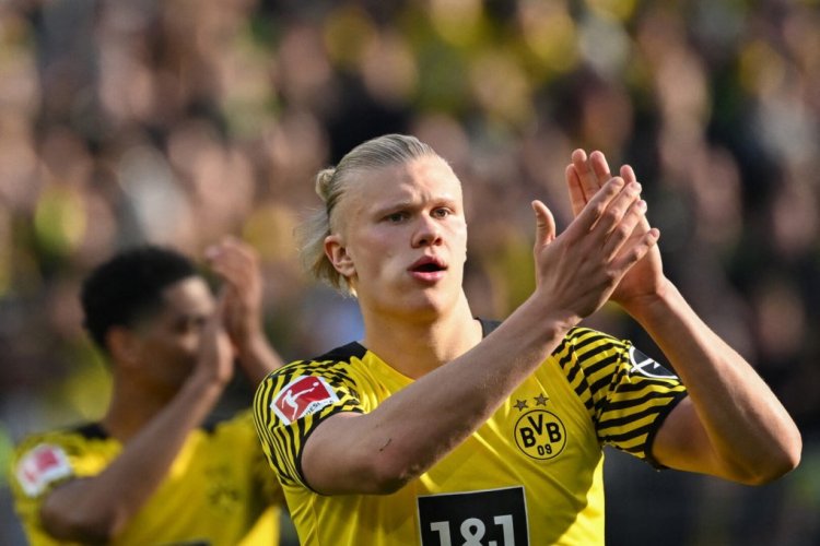 Dortmund's Norwegian forward Erling Braut Haaland applauds after the German first division Bundesliga football match Borussia Dortmund v VfL Wolfsburg in Dortmund, western Germany, on April 16, 2022. - DFL REGULATIONS PROHIBIT ANY USE OF PHOTOGRAPHS AS IMAGE SEQUENCES AND/OR QUASI-VIDEO 
ALTERNATIVE CROP (Photo by INA FASSBENDER / AFP) / DFL REGULATIONS PROHIBIT ANY USE OF PHOTOGRAPHS AS IMAGE SEQUENCES AND/OR QUASI-VIDEO 
ALTERNATIVE CROP (Photo by INA FASSBENDER/AFP via Getty Images)