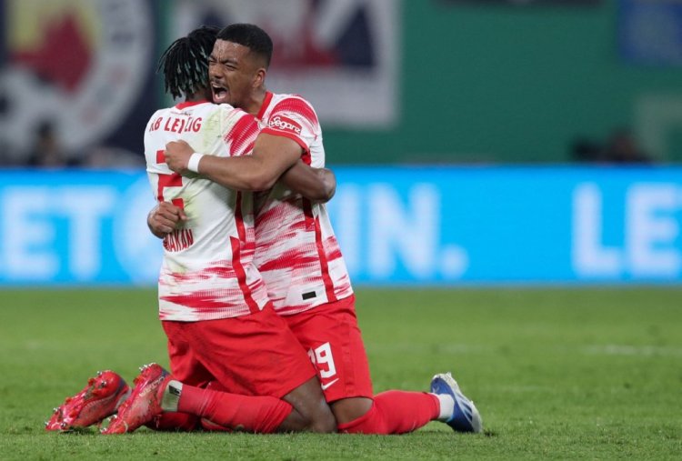 Leipzig's French defender Mohamed Simakan and Leipzig's German defender Benjamin Henrichs (R) celebrate after the German Cup (DFB Pokal) semi-final football match RB Leipzig v Union Berlin in Leipzig, eastern Germany on April 20, 2022. - - DFB REGULATIONS PROHIBIT ANY USE OF PHOTOGRAPHS AS IMAGE SEQUENCES AND QUASI-VIDEO. (Photo by Ronny HARTMANN / AFP) / DFB REGULATIONS PROHIBIT ANY USE OF PHOTOGRAPHS AS IMAGE SEQUENCES AND QUASI-VIDEO. (Photo by RONNY HARTMANN/AFP via Getty Images)