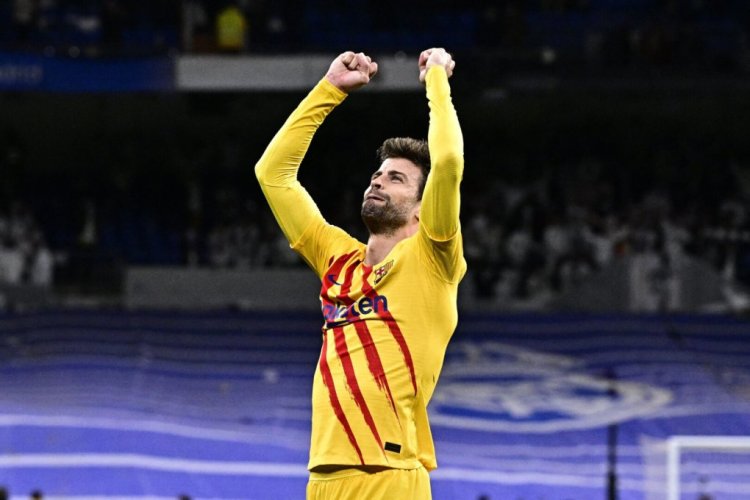 Barcelona's Spanish defender Gerard Pique celebrates at the end of the Spanish League football match between Real Madrid CF and FC Barcelona at the Santiago Bernabeu stadium in Madrid on March 20, 2022. (Photo by JAVIER SORIANO / AFP) (Photo by JAVIER SORIANO/AFP via Getty Images)