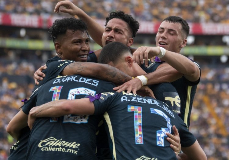 America' Diego Valdez (Covered) celebrates with teammates after scoring against Tigres during their Mexican Clausura 2022  tournament football, in Universitario stadium  in Monterrey, Mexico, on April 16,  2022. (Photo by Julio Cesar AGUILAR / AFP) (Photo by JULIO CESAR AGUILAR/AFP via Getty Images)
