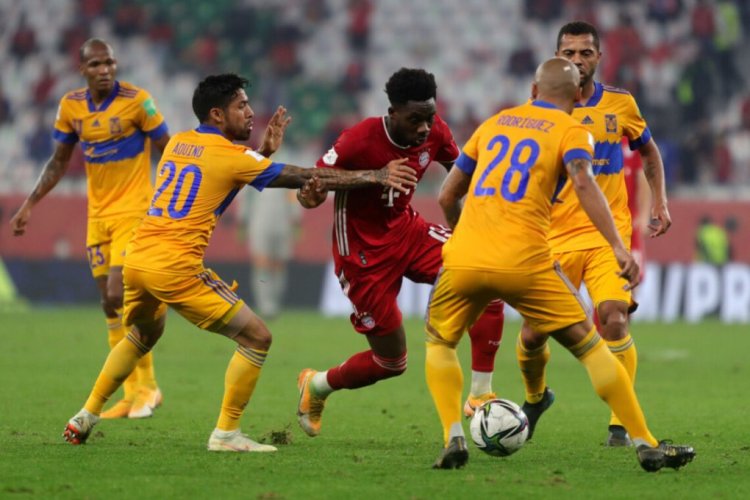 Bayern Munich's Canadian forward Alphonso Davies (C) is marked by Tigres' midfielder Javier Aquino (C-L) and Tigres' defender Luis Rodriguez (C-R) during the FIFA Club World Cup final football match between Germany's Bayern Munich vs Mexico's UANL Tigres at the Education City Stadium in the Qatari city of Ar-Rayyan on February 11, 2021. (Photo by - / AFP) (Photo by -/AFP via Getty Images)