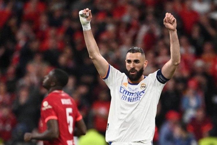 Real Madrid's French striker Karim Benzema celebrates his team's victory of the UEFA Champions League final football match between Liverpool and Real Madrid at the Stade de France in Saint-Denis, north of Paris, on May 28, 2022. (Photo by Anne-Christine POUJOULAT / AFP) (Photo by ANNE-CHRISTINE POUJOULAT/AFP via Getty Images)