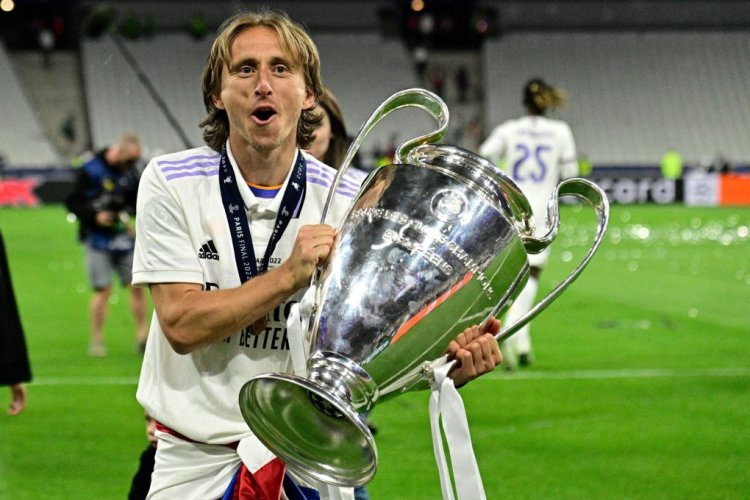 Real Madrid's Croatian midfielder Luka Modric celebrates with the trophy after the UEFA Champions League final football match between Liverpool and Real Madrid at the Stade de France in Saint-Denis, north of Paris, on May 28, 2022. - Real Madrid won the match 0-1. (Photo by JAVIER SORIANO / AFP) (Photo by JAVIER SORIANO/AFP via Getty Images)