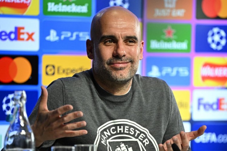 Manchester City's Spanish manager Pep Guardiola reacts as he speaks during a press conference at the Manchester City training ground, in Manchester, north west England, on May 3, 2022, on the eve of their UEFA Champions League semi-final second leg football match against Real Madrid. (Photo by Oli SCARFF / AFP) (Photo by OLI SCARFF/AFP via Getty Images)