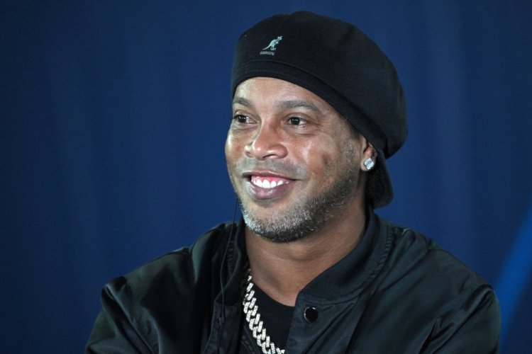 Former Brazilian soccer player Ronaldinho is pictured prior the UEFA Champions League first round Group A football match between Paris Saint-Germain's (PSG) and RB Leipzig, at The Parc des Princes stadium, in Paris, on October 19, 2021. (Photo by Anne-Christine POUJOULAT / AFP) (Photo by ANNE-CHRISTINE POUJOULAT/AFP via Getty Images)