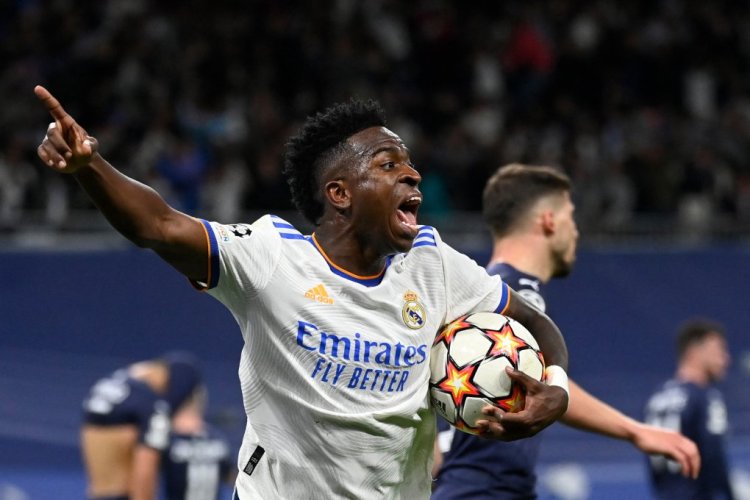 Real Madrid's Brazilian forward Vinicius Junior celebrates after Real Madrid's Brazilian forward Rodrygo scored a goal during the UEFA Champions League semi-final second leg football match between Real Madrid CF and Manchester City at the Santiago Bernabeu stadium in Madrid on May 4, 2022. (Photo by PIERRE-PHILIPPE MARCOU / AFP) (Photo by PIERRE-PHILIPPE MARCOU/AFP via Getty Images)