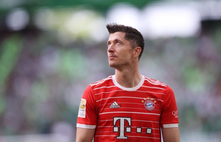 Bayern Munich's Polish forward Robert Lewandowski reacts after the German first division Bundesliga football match VfL Wolfsburg v Bayern Munich in Wolfsburg, northern Germany, on May 14, 2022. - DFL REGULATIONS PROHIBIT ANY USE OF PHOTOGRAPHS AS IMAGE SEQUENCES AND/OR QUASI-VIDEO (Photo by RONNY HARTMANN / AFP) / DFL REGULATIONS PROHIBIT ANY USE OF PHOTOGRAPHS AS IMAGE SEQUENCES AND/OR QUASI-VIDEO (Photo by RONNY HARTMANN/AFP via Getty Images)