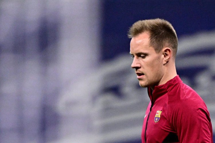 Barcelona's German goalkeeper Marc-Andre ter Stegen looks on during a warm up prior to the Spanish League football match between Real Madrid CF and FC Barcelona at the Santiago Bernabeu stadium in Madrid on March 20, 2022. (Photo by JAVIER SORIANO / AFP) (Photo by JAVIER SORIANO/AFP via Getty Images)