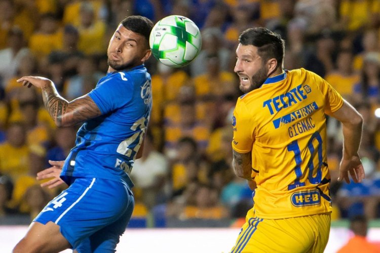 Andre Pierre Gignac (R) of Tigres vies for the ball with Juan Escobar (L) of Cruz Azul during a Mexican Clausura tournament football match between Cruz Azul and Tigres at Universitario stadium in Monterrey, Mexico, on May 15, 2022. (Photo by Julio Cesar AGUILAR / AFP) (Photo by JULIO CESAR AGUILAR/AFP via Getty Images)