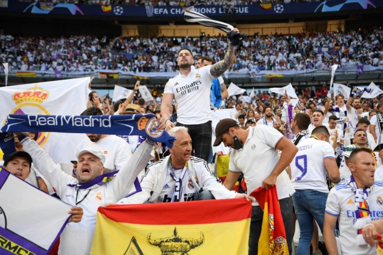 PARIS, FRANCE - MAY 28: Real Madrid fans hold scarves and show their support prior to the UEFA Champions League final match between Liverpool FC and Real Madrid at Stade de France on May 28, 2022 in Paris, France. (Photo by Shaun Botterill/Getty Images)
