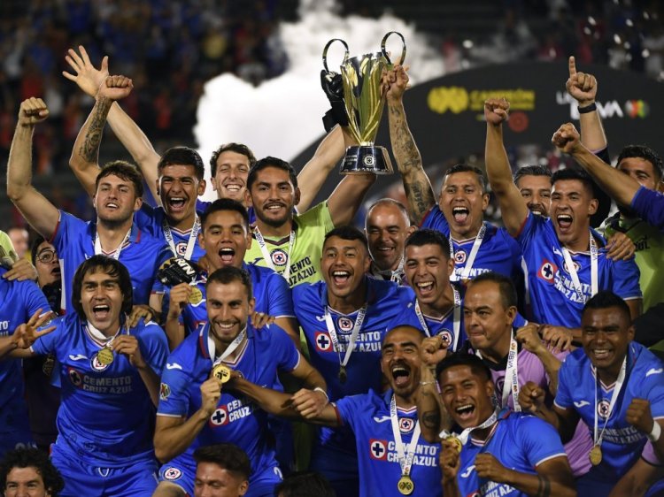 CARSON, CA - JUNE 26: Goalkeeper Jose Corona #1 and Julio Dominguez #4 of Cruz Azul hold up the championship trophy after defeating Atlas in penalty kicks at the Campeon de Campeones 2022 soccer match at Dignity Health Sports Park on June 26, 2022 in Carson, California. (Photo by Kevork Djansezian/Getty Images)