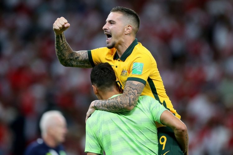 DOHA, QATAR - JUNE 13: Jamie Maclaren of Australia celebrates following their sides victory in the 2022 FIFA World Cup Playoff match between Australia Socceroos and Peru at Ahmad Bin Ali Stadium on June 13, 2022 in Doha, Qatar. (Photo by Mohamed Farag/Getty Images)