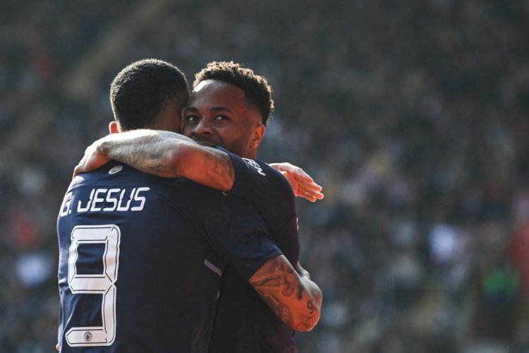 Manchester City's English midfielder Raheem Sterling (R) celebrates with Manchester City's Brazilian striker Gabriel Jesus (L) after scoring his team first goal during the English FA cup quarter-final football match between Southampton and Manchester City at St Mary's Stadium in Southampton, Southern England on March 20, 2022. - - RESTRICTED TO EDITORIAL USE. No use with unauthorized audio, video, data, fixture lists, club/league logos or 'live' services. Online in-match use limited to 120 images. An additional 40 images may be used in extra time. No video emulation. Social media in-match use limited to 120 images. An additional 40 images may be used in extra time. No use in betting publications, games or single club/league/player publications. (Photo by Glyn KIRK / AFP) / RESTRICTED TO EDITORIAL USE. No use with unauthorized audio, video, data, fixture lists, club/league logos or 'live' services. Online in-match use limited to 120 images. An additional 40 images may be used in extra time. No video emulation. Social media in-match use limited to 120 images. An additional 40 images may be used in extra time. No use in betting publications, games or single club/league/player publications. / RESTRICTED TO EDITORIAL USE. No use with unauthorized audio, video, data, fixture lists, club/league logos or 'live' services. Online in-match use limited to 120 images. An additional 40 images may be used in extra time. No video emulation. Social media in-match use limited to 120 images. An additional 40 images may be used in extra time. No use in betting publications, games or single club/league/player publications. (Photo by GLYN KIRK/AFP via Getty Images)