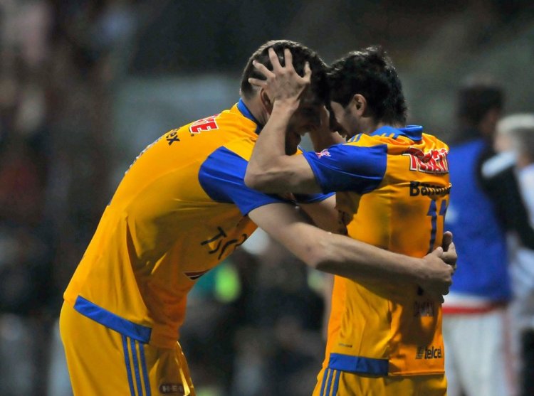 Andre Gignac (L) and Damian Alvarez (R) of Tigres, celebrates a goal against Toluca during the semifinal match of the Mexican Apertura Tournament at the Nemesio Diez stadium on December 06, 2015, in Toluca, Mexico. AFP PHOTO/MARIA CALLS / AFP / MARIA CALLS        (Photo credit should read MARIA CALLS/AFP via Getty Images)