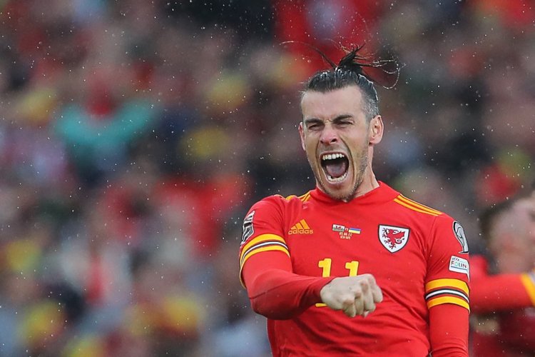 Wales' striker Gareth Bale  celebrates   after winning the FIFA World Cup 2022 play-off final qualifier football match between Wales and Ukraine at the Cardiff City Stadium in Cardiff, south Wales, on June 5, 2022. (Photo by Geoff Caddick / AFP) (Photo by GEOFF CADDICK/AFP via Getty Images)