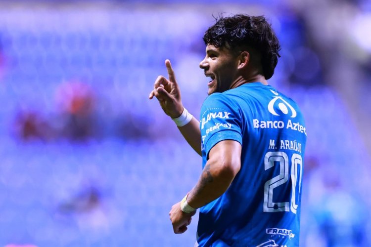 PUEBLA, MEXICO - JANUARY 28: Maximiliano Araujo of Puebla celebrates after scoring the second goal of his team during the 3rd round match between Puebla and Club Tijuana as part of the Torneo Grita Mexico C22 at Cuauhtemoc Stadium on January 28, 2022 in Puebla, Mexico. (Photo by Hector Vivas/Getty Images)