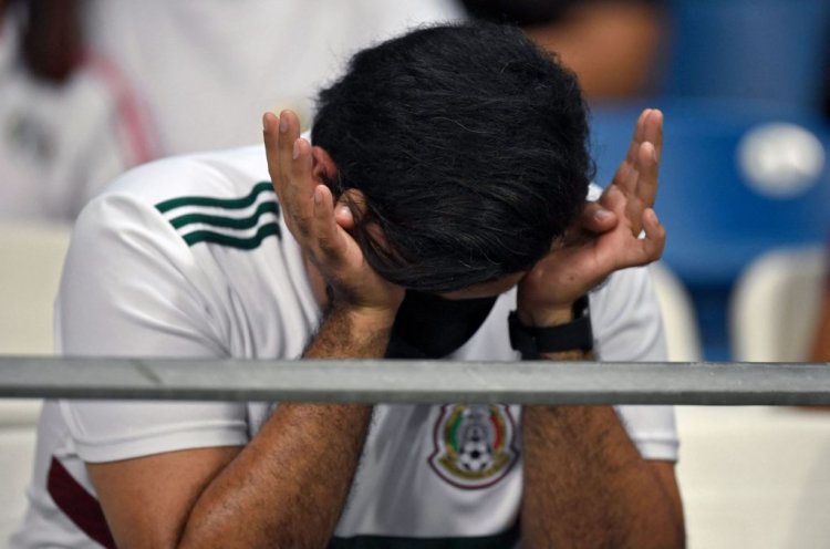 A fan of Mexico reacts after the team lost 3-0 to Haiti in a women's 2022 Concacaf football championship match at the BBVA Bancomer stadium in Monterrey, Nuevo Leon State, Mexico, on July 7, 2022. (Photo by Alfredo ESTRELLA / AFP) (Photo by ALFREDO ESTRELLA/AFP via Getty Images)