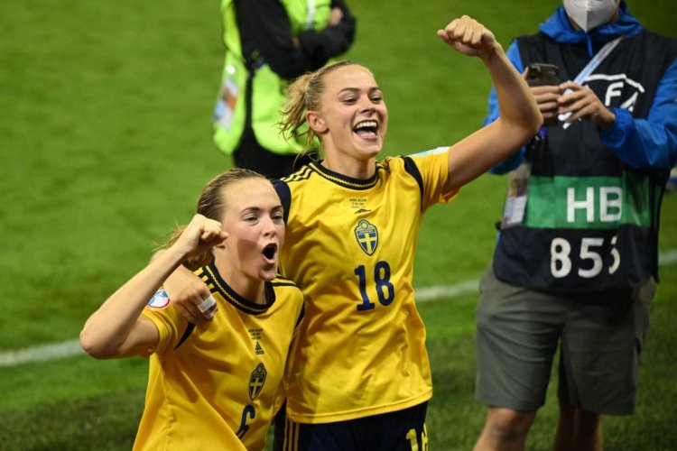 Sweden's defender Magdalena Eriksson (L) and Sweden's striker Fridolina Rolfo celebrate their victory at the end of the UEFA Women's Euro 2022 quarter final football match between Sweden and Belgium at the Leigh Sports Village Stadium, in Leigh, on July 22, 2022. - No use as moving pictures or quasi-video streaming. 
Photos must therefore be posted with an interval of at least 20 seconds. (Photo by Oli SCARFF / AFP) / No use as moving pictures or quasi-video streaming. 
Photos must therefore be posted with an interval of at least 20 seconds. (Photo by OLI SCARFF/AFP via Getty Images)