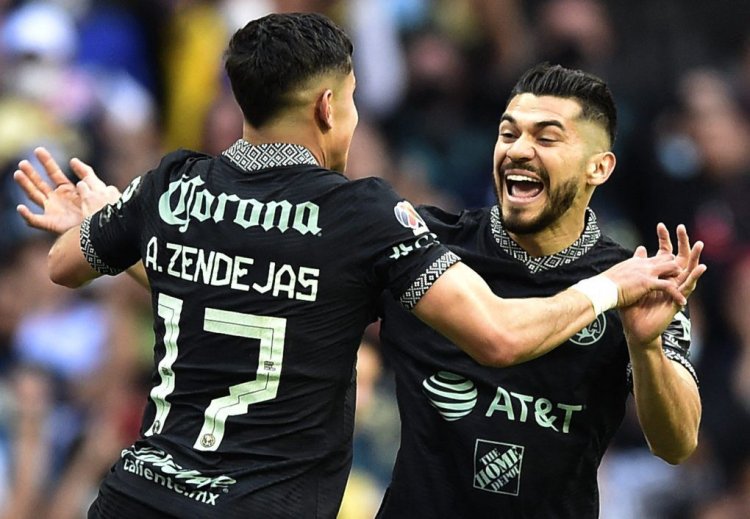 Alejandro Zendejas (L) of America celebrates with teammate Henry Martin after scoring against Toluca during the Mexican Clausura football tournament match at the Azteca stadium in Mexico City, on March 20, 2022. (Photo by CLAUDIO CRUZ / AFP) (Photo by CLAUDIO CRUZ/AFP via Getty Images)