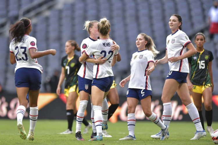MONTERREY, MEXICO - JULY 07: Kristie Mewis of USA celebrates with teammates after scoring her team's fourth goal via penalty during the match between Jamaica and United States as part of the 2022 Concacaf W Championship at BBVA Stadium on July 07, 2022 in Monterrey, Mexico. (Photo by Azael Rodriguez/Getty Images)