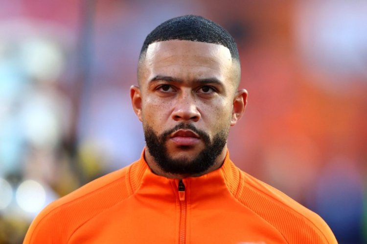 ROTTERDAM, NETHERLANDS - JUNE 11: Memphis Depay of Netherlands stands for the national anthem prior to the UEFA Nations League League A Group 4 match between Netherlands and Poland at Stadium Feijenoord on June 11, 2022 in Rotterdam, Netherlands. (Photo by Dean Mouhtaropoulos/Getty Images)
