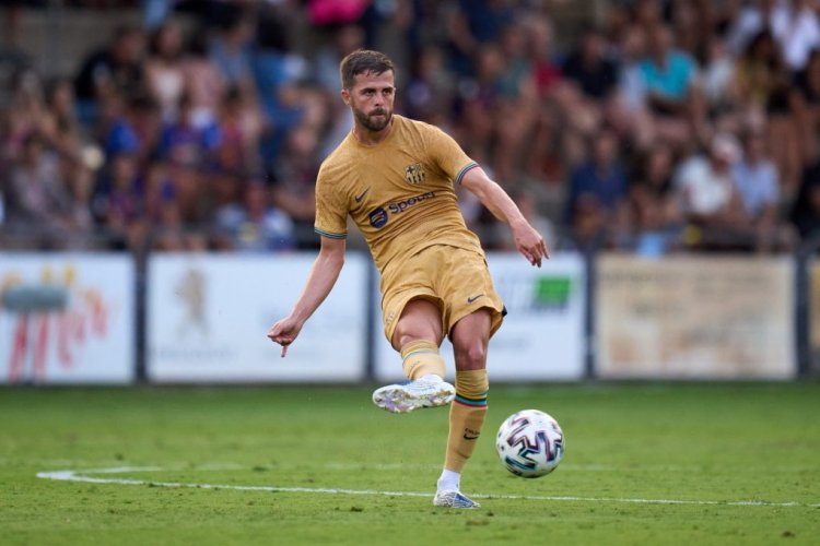 OLOT, SPAIN - JULY 13: Miralem Pjanic of FC Barcelona passes the ball during the pre-season friendly match between UE Olot and FC Barcelona at Nou Estadi Municipal on July 13, 2022 in Olot, Spain. (Photo by Alex Caparros/Getty Images)