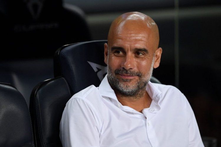 Manchester City's Spanish manager Pep Guardiola looks on before the start of the friendly football match between FC Barcelona and Manchester City, at the Camp Nou stadium in Barcelona on August 24, 2022. (Photo by Josep LAGO / AFP) (Photo by JOSEP LAGO/AFP via Getty Images)