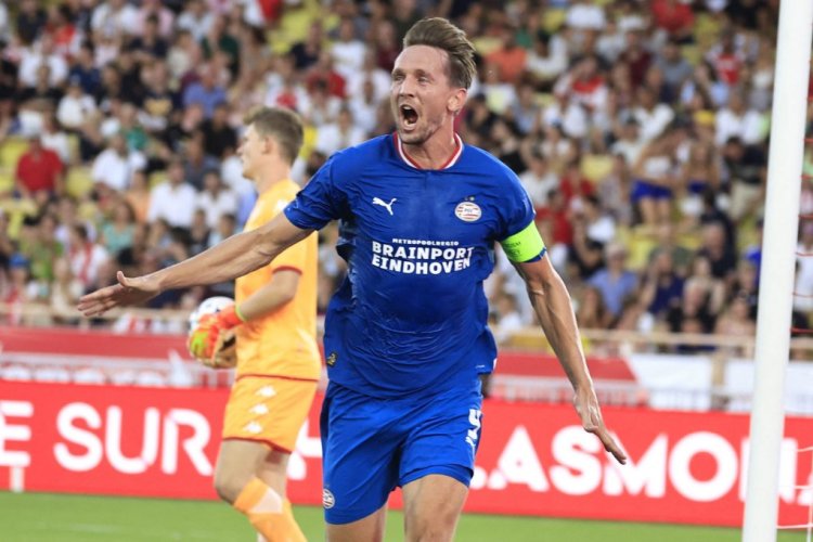 PSV Eindhoven's Dutch forward Luuk De Jong celebrates after midfielder Joey Veerman scored a goal during the UEFA Champions League third qualifying round first leg football match between AS Monaco and PSV Eindhoven at the "Louis II Stadium" in Monaco on August 2, 2022. (Photo by Valery HACHE / AFP) (Photo by VALERY HACHE/AFP via Getty Images)