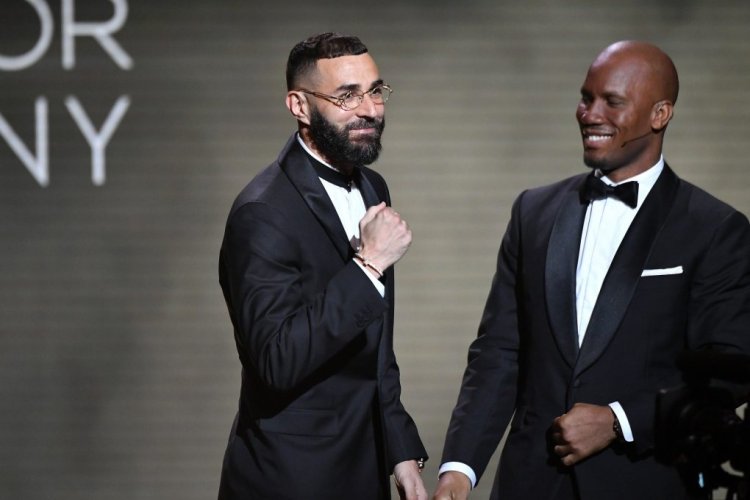 PARIS, FRANCE - OCTOBER 17: Karim Benzema (L) and Didier Drogba (R) speak on stage during the Ballon D'Or ceremony at Theatre Du Chatelet In Paris on October 17, 2022 in Paris, France. (Photo by Aurelien Meunier/Getty Images)