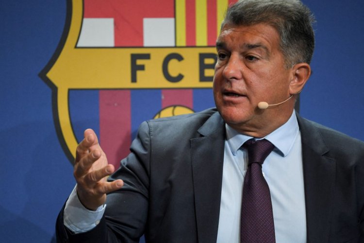 Barcelona's Spanish President Joan Laporta gestures as he addresses a press conference to present the results of a club investigation into financial mismanagement under the previous board, in Barcelona on February 1, 2022. - The "forensic report" focuses on various financial issues, including money paid to agents and the spreading of fees over numerous contracts, allegedly to avoid exceeding spending limits, with former president Josep Maria Bartomeu expected to be in the firing line. (Photo by LLUIS GENE / AFP) (Photo by LLUIS GENE/AFP via Getty Images)