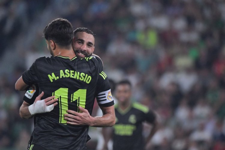 Real Madrid's Spanish midfielder Marco Asensio celebrates with Real Madrid's French forward Karim Benzema (R) scoring his team's third goal during the Spanish league football match between Elche CF and Real Madrid CF at the Martinez Valero stadium in Elche on October 19, 2022. (Photo by JOSE JORDAN / AFP) (Photo by JOSE JORDAN/AFP via Getty Images)