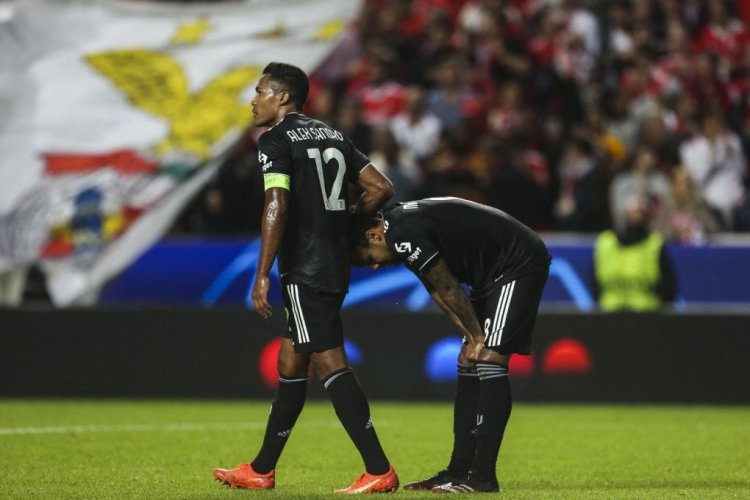 Juventus' Brazilian defender Alex Sandro (L) conforts Juventus' US midfielder Weston Mckennie at the end of the UEFA Champions League 2nd round group H football match between SL Benfica and Juventus FC, at the Luz stadium in Lisbon on October 25, 2022. - Benfica won 4-3. (Photo by CARLOS COSTA / AFP) (Photo by CARLOS COSTA/AFP via Getty Images)