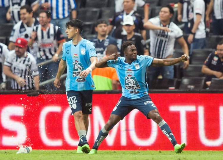 Pachuca's Aviles Hurtado (R) celebrates after scoring a penalty against Monterrey during their Mexican Apertura football tournament semifinal match at the BBVA Bancomer stadium, in Monterrey, Mexico, on October 23, 2022. (Photo by Julio Cesar AGUILAR / AFP) (Photo by JULIO CESAR AGUILAR/AFP via Getty Images)