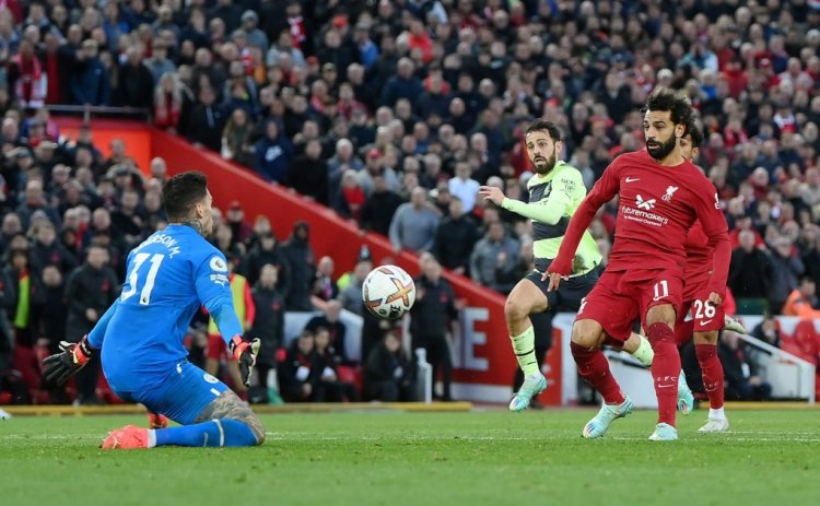 LIVERPOOL, ENGLAND - OCTOBER 16: Mohamed Salah of Liverpool scores their side's first goal past Ederson of Manchester City during the Premier League match between Liverpool FC and Manchester City at Anfield on October 16, 2022 in Liverpool, England. (Photo by Laurence Griffiths/Getty Images)