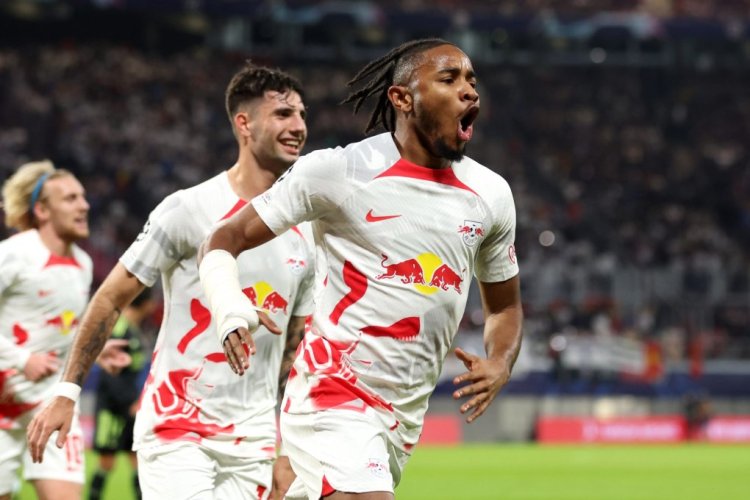 LEIPZIG, GERMANY - OCTOBER 25: Christopher Nkunku of RB Leipzig celebrates scoring their side's second goal with teammates during the UEFA Champions League group F match between RB Leipzig and Real Madrid at Red Bull Arena on October 25, 2022 in Leipzig, Germany. (Photo by Maja Hitij/Getty Images)