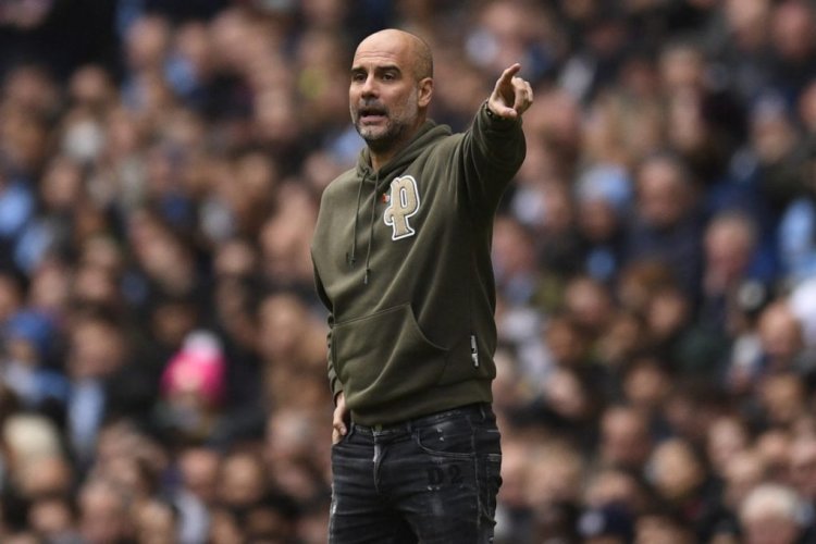 Manchester City's Spanish manager Pep Guardiola gestures on the touchline during the English Premier League football match between Manchester City and Brentford at the Etihad Stadium in Manchester, north west England, on November 12, 2022. - RESTRICTED TO EDITORIAL USE. No use with unauthorized audio, video, data, fixture lists, club/league logos or 'live' services. Online in-match use limited to 120 images. An additional 40 images may be used in extra time. No video emulation. Social media in-match use limited to 120 images. An additional 40 images may be used in extra time. No use in betting publications, games or single club/league/player publications. (Photo by Oli SCARFF / AFP) / RESTRICTED TO EDITORIAL USE. No use with unauthorized audio, video, data, fixture lists, club/league logos or 'live' services. Online in-match use limited to 120 images. An additional 40 images may be used in extra time. No video emulation. Social media in-match use limited to 120 images. An additional 40 images may be used in extra time. No use in betting publications, games or single club/league/player publications. / RESTRICTED TO EDITORIAL USE. No use with unauthorized audio, video, data, fixture lists, club/league logos or 'live' services. Online in-match use limited to 120 images. An additional 40 images may be used in extra time. No video emulation. Social media in-match use limited to 120 images. An additional 40 images may be used in extra time. No use in betting publications, games or single club/league/player publications. (Photo by OLI SCARFF/AFP via Getty Images)
