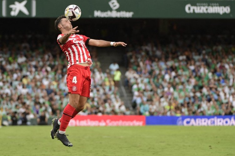 Girona's Spanish defender Arnau Martinez heads the ball during the Spanish League football match between Real Betis and Girona FC at the Benito Villamarin stadium in Seville on September 18, 2022. (Photo by CRISTINA QUICLER / AFP) (Photo by CRISTINA QUICLER/AFP via Getty Images)